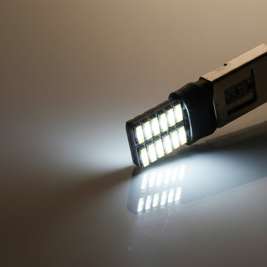 Car LED bulb on a reflective surface with a neutral background