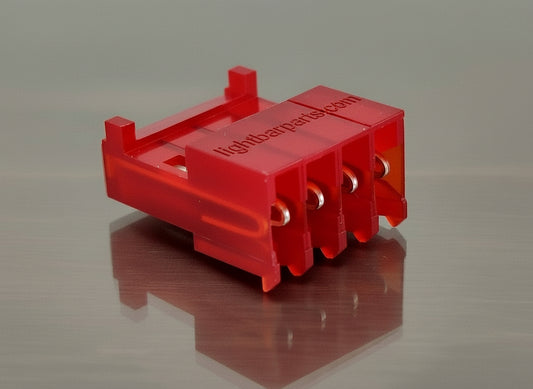 Red plastic component on a white background