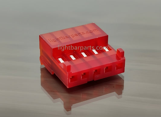 Red plastic component on a white background